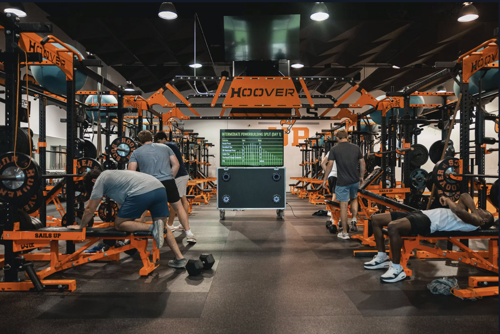 Athletic facility weight room with digital communication display technology